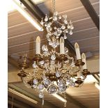 A ten-light gilt metal lustre drop chandelier