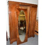 An Edwardian triple door mirrored wardrobe, 198cm high