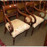 A pair of early 19th century mahogany open armchairs (2)