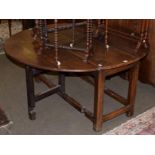 An 18th century and later oak drop leaf table, 137cm diameter