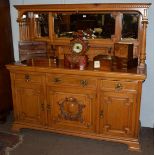 A Maple & Co light oak sideboard, enclosed gallery back with triple bevelled glass mirrors, column