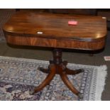 A George III mahogany fold over tea table, turned column, four out-swept leg to castors, 90cm wide