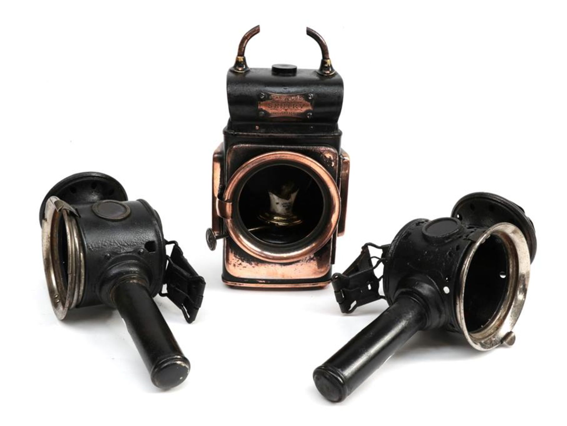 A Pair of Early 20th Century Luxor Bicycle or Tricycle Headlamps, 24cm high; and A Lucas Sentry No.