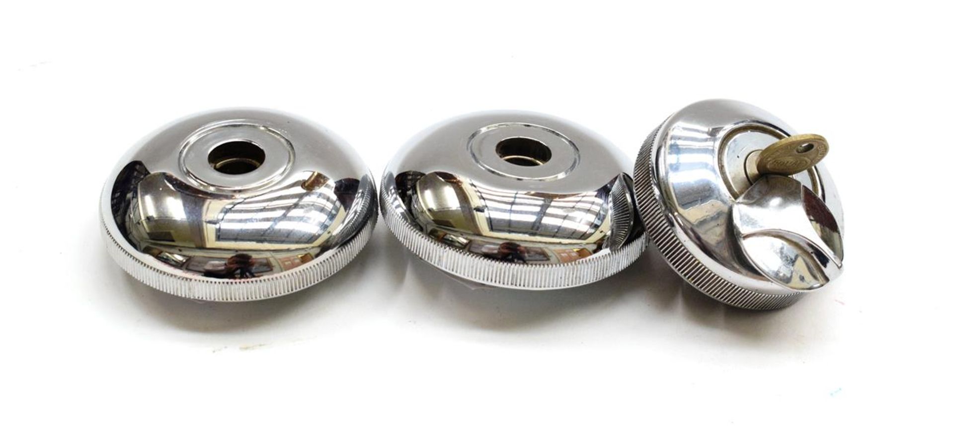 A Pair of Chromed Car Locking Caps, suitable for mounting mascots, the underside stamped Made in