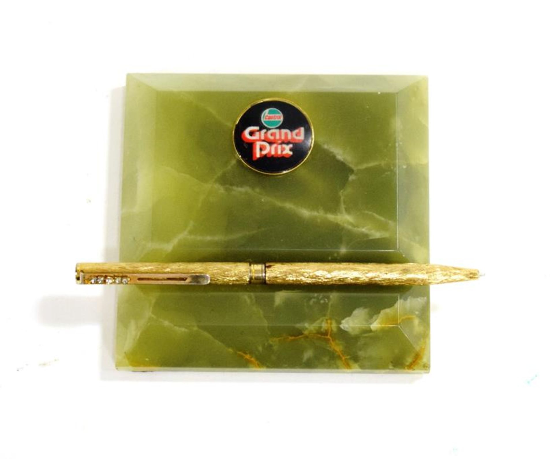 A 1970's Green Onyx Desktop Pen Holder/Paperweight, labelled Castrol Grand Prix, 10cm by 10cm