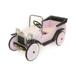 A Child's Vintage Style Pink Metal Bodied Pedal Car, with three-spoke steering wheel, solid wheels