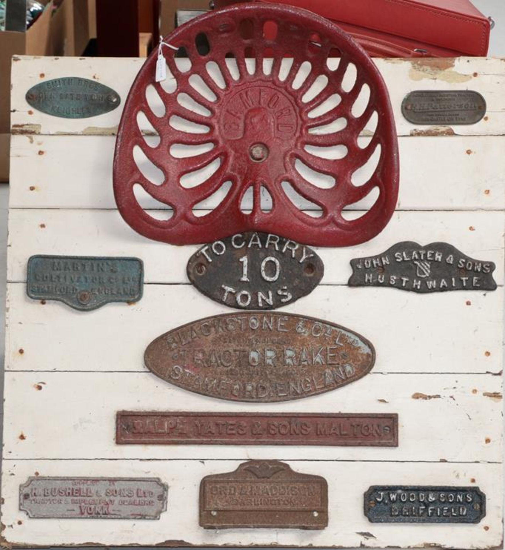 Tractor Interest: A Painted Display Board, mounted with a Bamford tractor seat and ten name