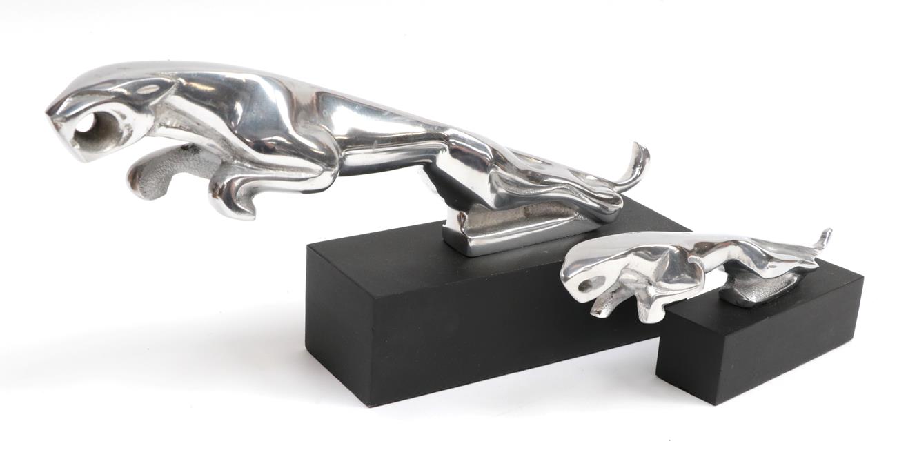 A Chromed Car Mascot as a Leaping Jaguar, mounted on an ebonised base, 30cm long; and A Similar