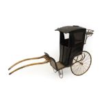 A Late Victorian Child's Two-Wheel Cart, as a hansom cab, with black and red painted coachwork,