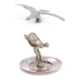 A Chromed Car Mascot as Spirit of Ecstasy, mounted on a silver plated circular dish, 11cm high;