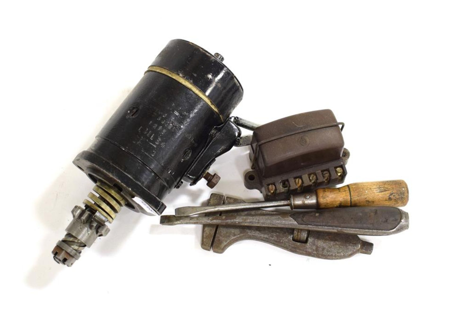 AN Austin 7 6 Volt Starter; A 6 Volt Voltage Regulator; Two Wooden-Handled Slot-Headed Screwdrivers;