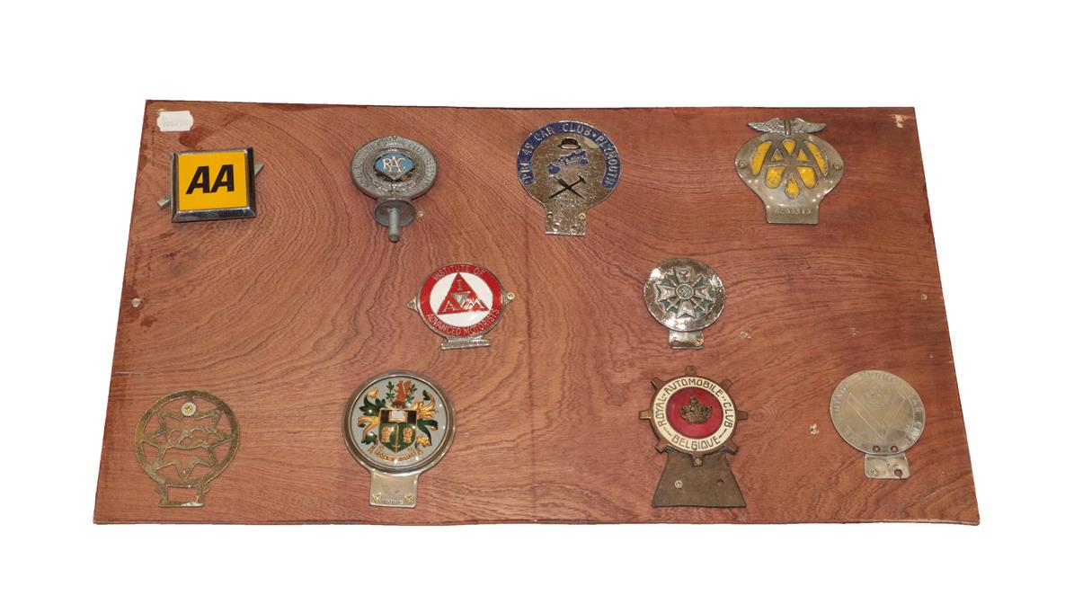 Ten Chromed Car Badges, mounted on a display board, including RAC, Belgique crown badge, vintage