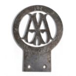 An Early 20th Century Chrome Plated on Brass Wingless AA Motorist Badge, signed Stenson Cooke, the