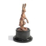 Alvis: A Brass Car Mascot as a Hare, modelled with large ears and feet, the base indistinctly