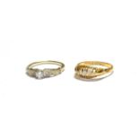 An 18 carat gold diamond five stone ring, finger size O; and a diamond solitaire ring, with textured