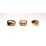 A 9 carat gold garnet ring, finger size T1/2; a 9 carat gold signet ring, out of shape; and a 9