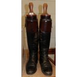 Pair of leather riding boots with boot trees
