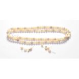 A single row multi-coloured cultured pearl necklace, length 100cm (approximately); and a pair of 9