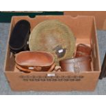 A World War II helmet and four pairs of binoculars