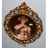 After Georg Hom (1838-1911) ''Lisette'', a painted Vienna porcelain dish, within a gilt carved