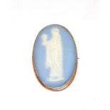 A Wedgwood brooch, within a beaded gilt metal frame, measures 6.5cm by 4.2cm . Gross weight 29.1