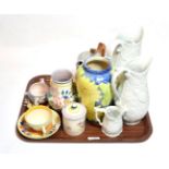 A Clarice Cliff Bizarre ware crocus pattern tea cup and saucer; Portmerion jugs; Poole pottery;