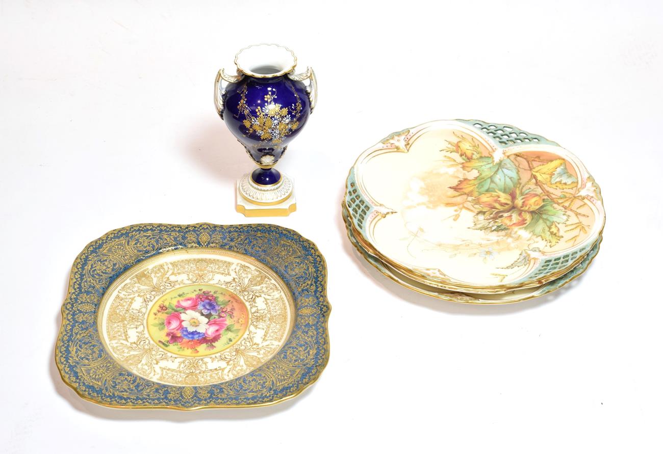 A Royal Worcester floral painted gilt-highlight plate, signed E.Barker (a.f.); together with three