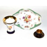 A Meissen floral painted vase, 14cm high, a Royal Worcester gilt and black coffee can and saucer;