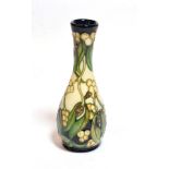 A Moorcroft pottery ''Mistletoe'' pattern vase by Rachel Bishop, 21cm high . Good condition.