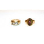 A 9 carat gold diamond four stone ring, finger size R; and a 9 carat gold signet ring, finger size