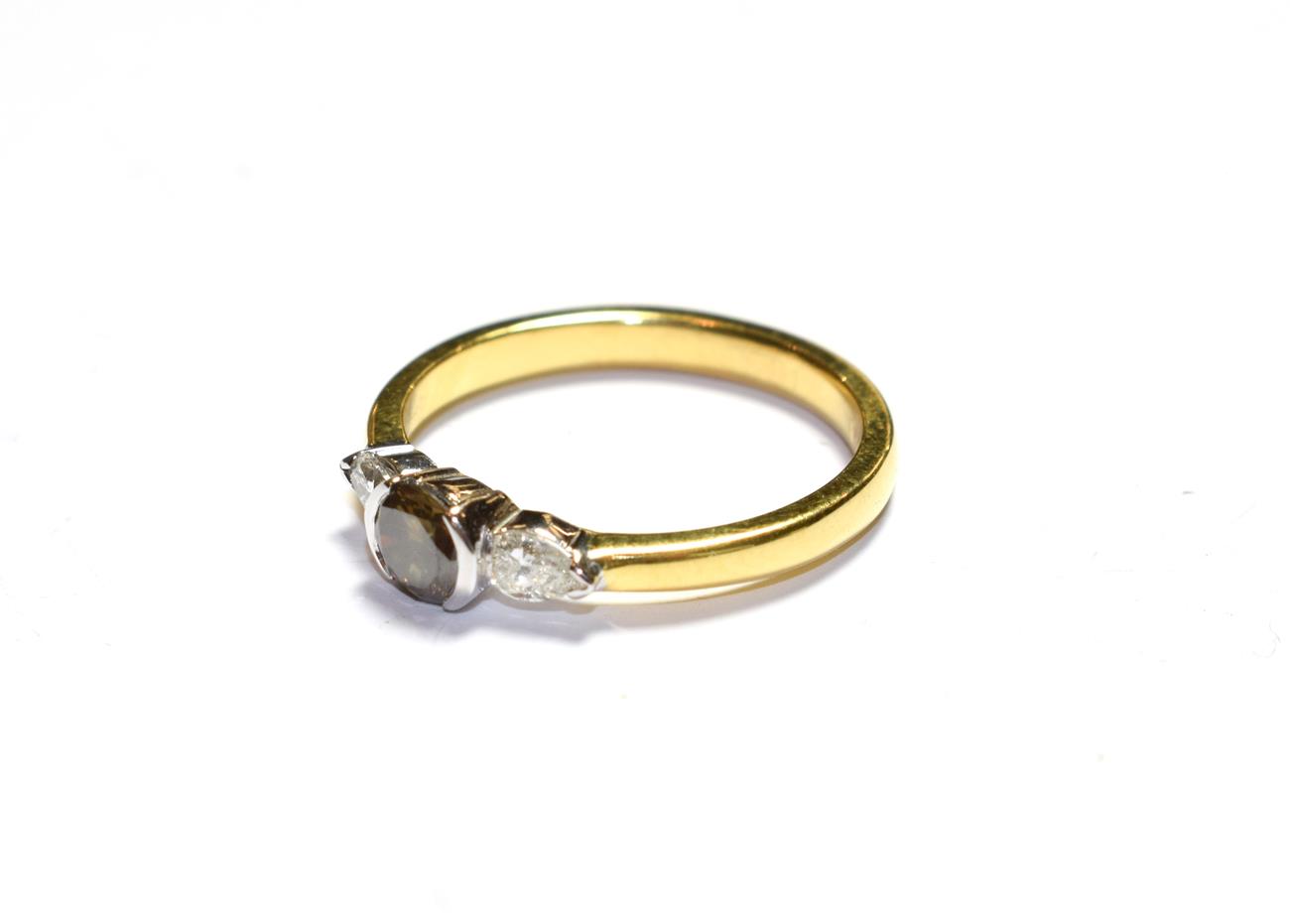 An 18 carat gold diamond solitaire ring, the fancy cinnamon round brilliant cut diamond, to pear cut