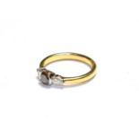 An 18 carat gold diamond solitaire ring, the fancy cinnamon round brilliant cut diamond, to pear cut