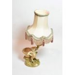 A Royal Worcester blush ivory figural candlestick, model number 1365, with puce painted marks and