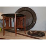 A Benares brass and enamel tray top table with folding stand, a large punch decorated copper charger