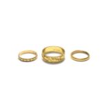 Two 18 carat gold band rings, finger sizes L and V; and a 22 carat gold band ring, finger size I1/2.
