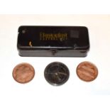 A pocket compass with sundial; together with two large 1972 US One Cent medallions and an