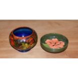 A 1950's Moorcroft pottery anemone pattern bowl, 8cm diameter, together with a small Moorcroft