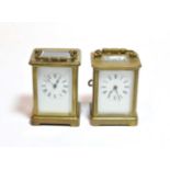 Two brass carriage timepieces, circa 1910, with enamel dials