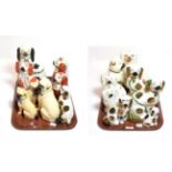 Two trays of 19th century Staffordshire seated spaniels and pugs
