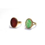 A 9 carat gold jade ring, finger size M; and a cornelain intaglio ring, stamped '9CT', finger size