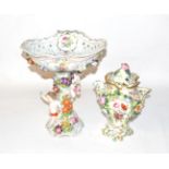 A Dresden figural centrepiece, the pierced basket painted with flower and ribbon-tied swags, the