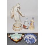 A Royal Worcester model of a Classical maiden, 41cm high; together with two Royal Worcester figures,