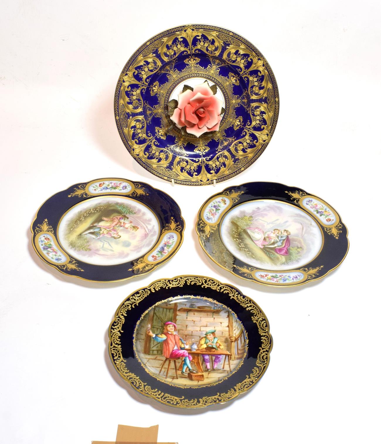 Three Sevres porcelain cabinet plates, painted with various scenes, largest 24cm diameter;