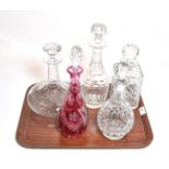 Five various decanters including a cranberry example (5)