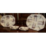 Two large graduated Ironstone serving plates, largest 62cm by 47cm; together with a pair of matching