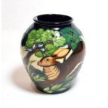 A Moorcroft pottery ''Flanders Moss'' pattern vase by Phillip Gibson, number 214/250, with painted