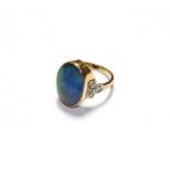 An opal doublet and diamond ring, stamped '9CT', finger size N. Gross weight 5.5 grams.