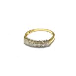 An 18 carat gold diamond seven stone ring, finger size O. Gross weight 2.3 grams.