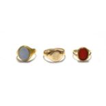 Three 9 carat gold signet rings (two inset with hardstones), finger sizes K, L1/2 and S1/2. Gross