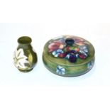 A Moorcroft pottery Orchid pattern jar and cover, 15cm diameter, together with a Hibiscus pattern